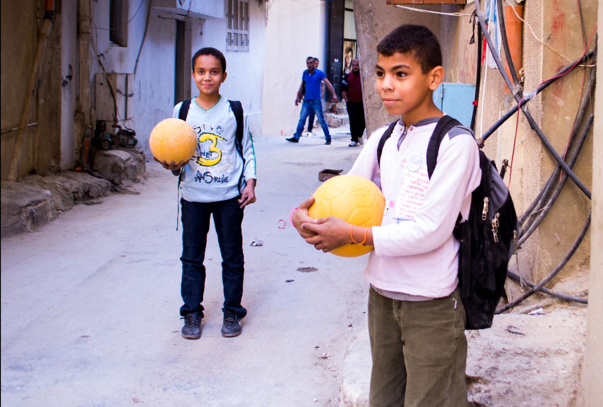 Boys in Beddawi Palestinian Camp in Lebanon are thrilled to get Anera's soccer balls and the opportunity to play.