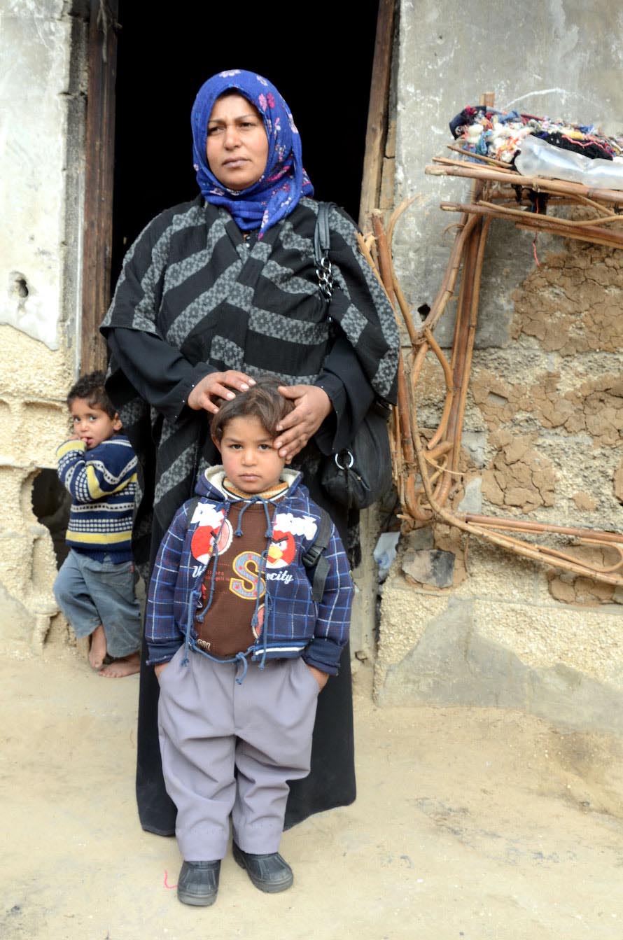 Gaza children like 5-year-old Ali and his mother have been left impoverished by the blockade and Gaza war.