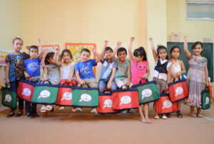 West Bank preschoolers with their new Anera-distributed bookbags full of fun children's books and educational materials.