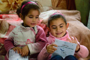 Wala'a and Zahra'a, Syrian sisters, received winter kits.