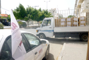 Truck piled with Anera food packages for families displaced by the Gaza war in 2014.