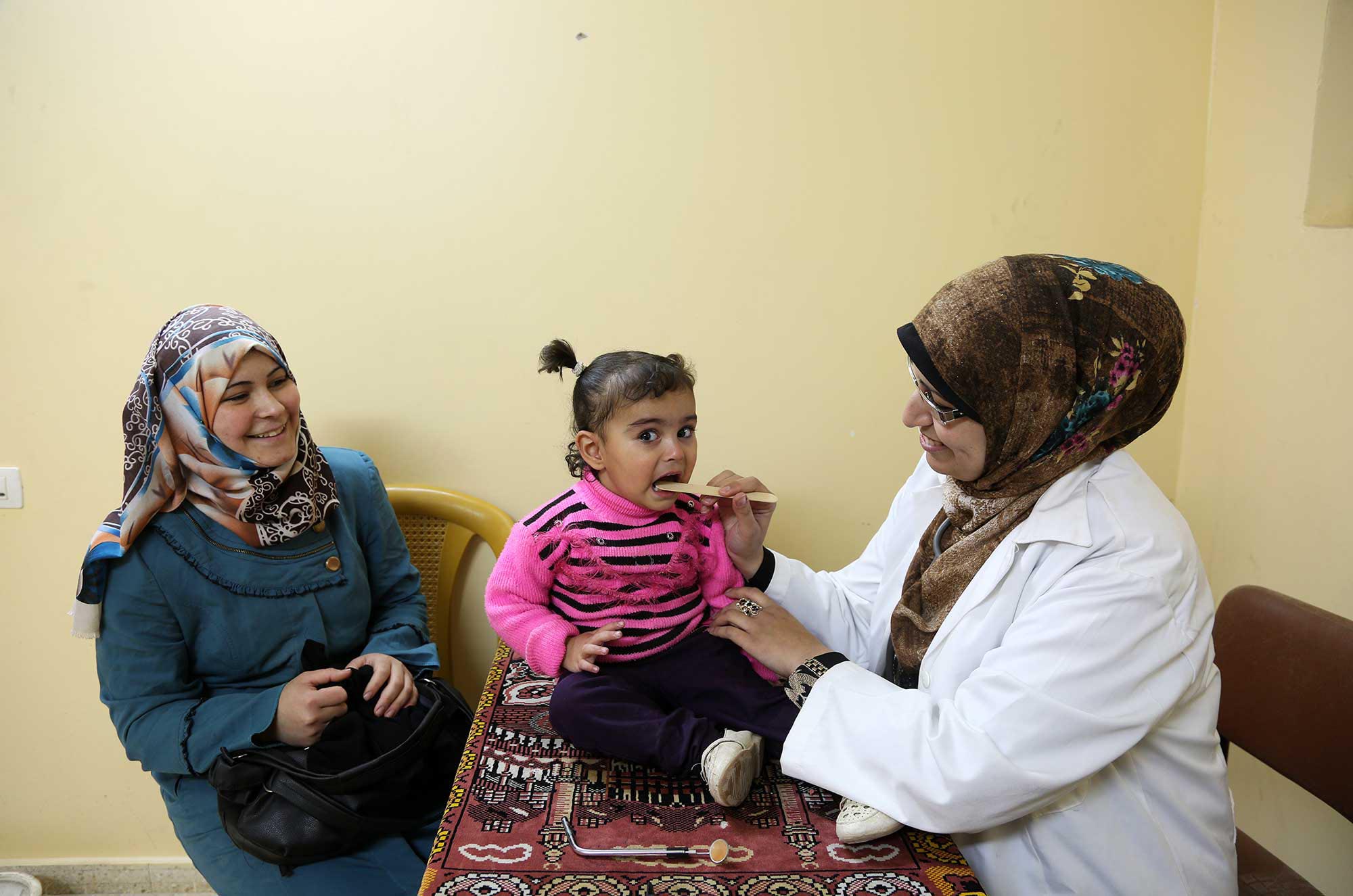 Rahaf is tested for parasites at the clinic after her mother recognized her symptoms in Anera’s hygiene awareness session.