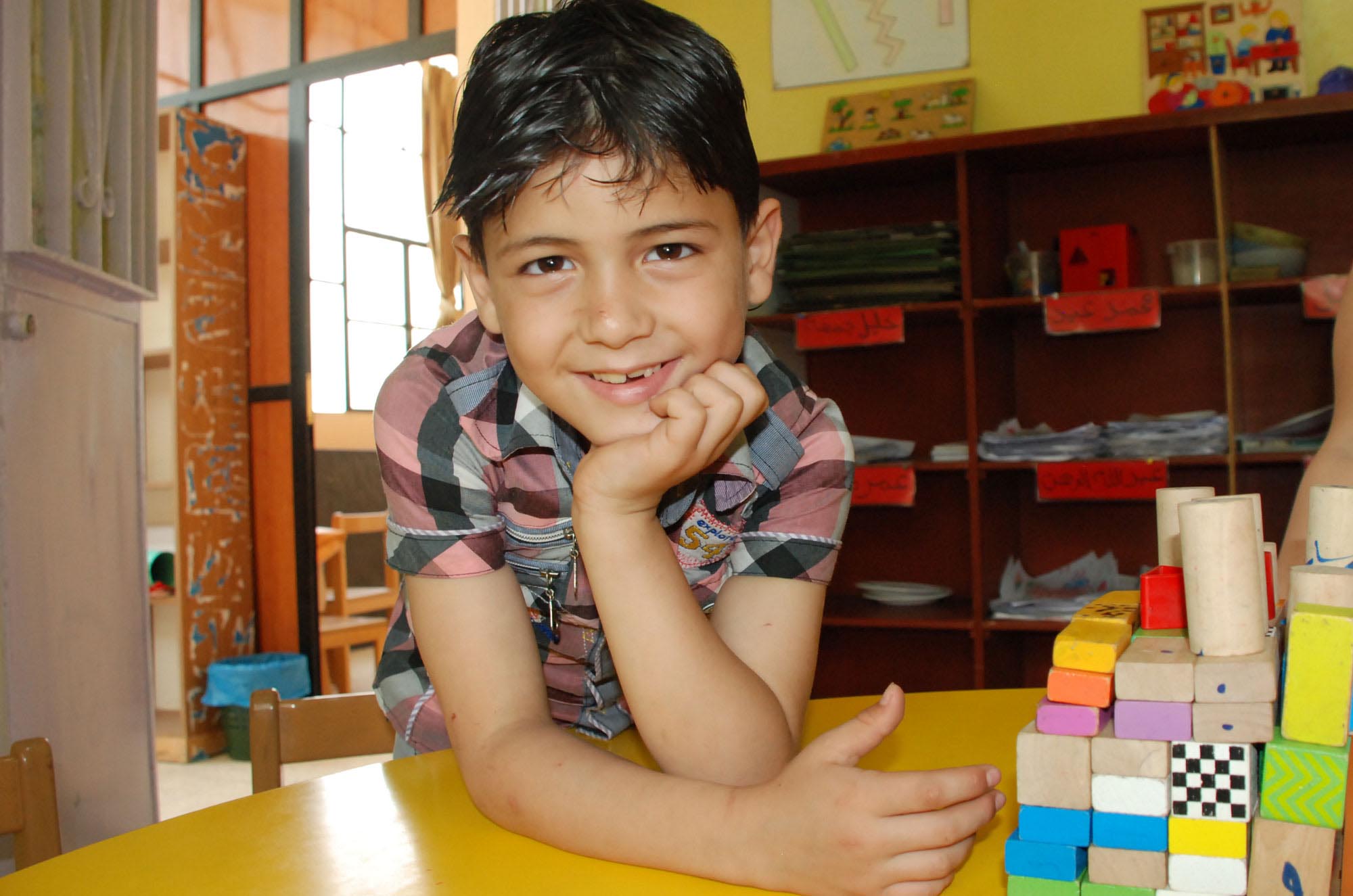 Mounir smiles with confidence after his grades improved, thanks to Anera’s learning support program in Nahr El Bared camp, Lebanon.