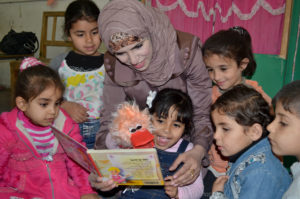 Gaza preschool teacher Mona Abu Jurai uses colorful puppets and other props she learned about in Anera's Right Start! training program.