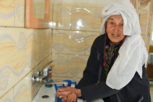 Bedouin women Hajje Fatmeh is thrilled to finally have water in her home.