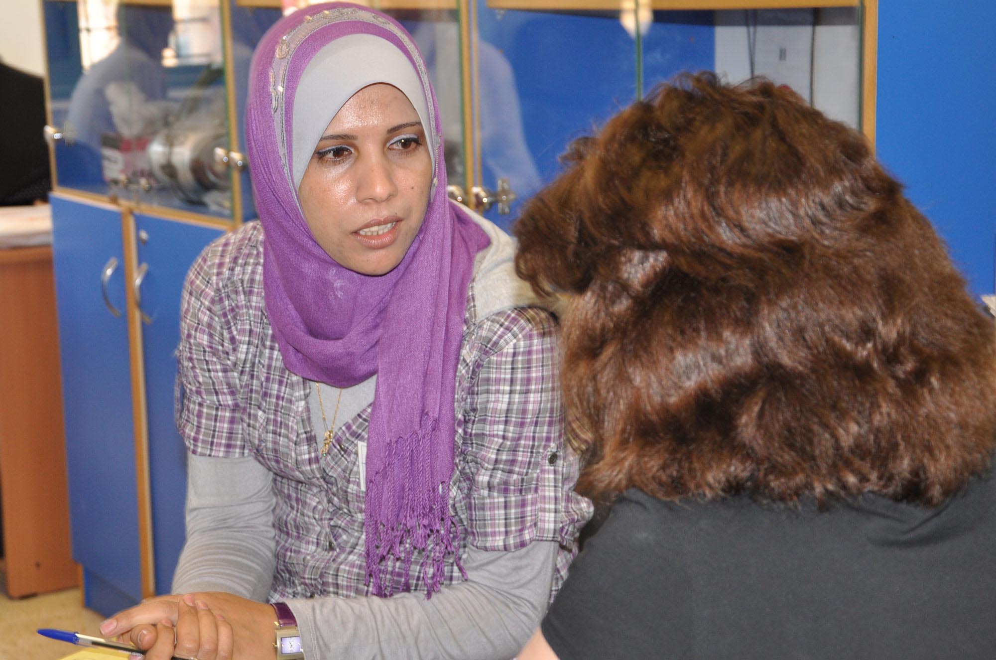 Palestinian preschool teacher Maha Abu Akar speaks with Anera's Early Childhood Development manager in the West Bank.