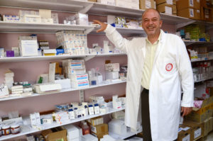 Anera distributed Indocin, donated by AmeriCares,a medicine that relieves pain, stiffness and swelling. This West Bank pharmacist is happy to have a supply at his charitable clinic.