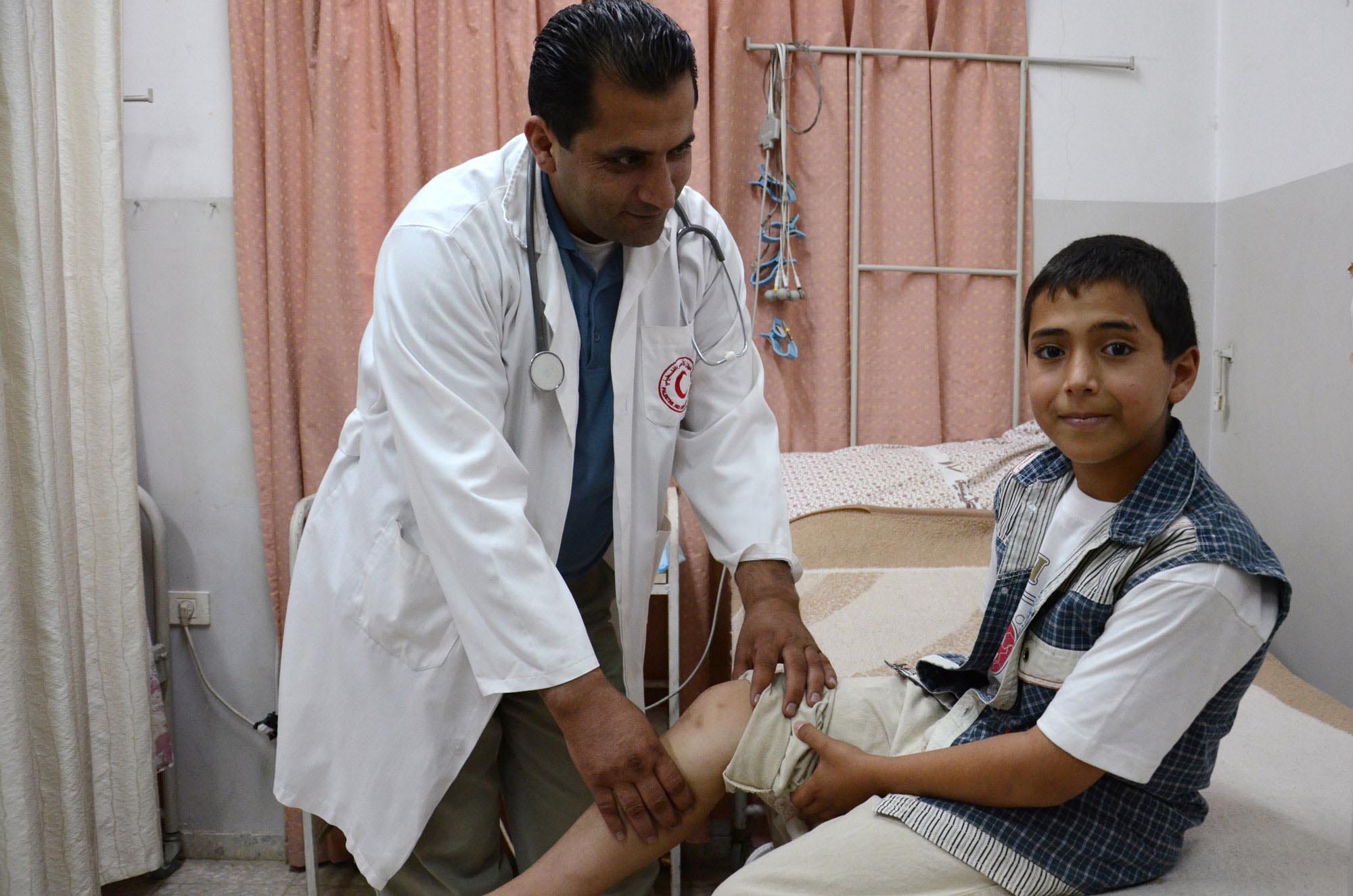 Haitham's leg muscle pain is relieved with donated medicines delivered by Anera.