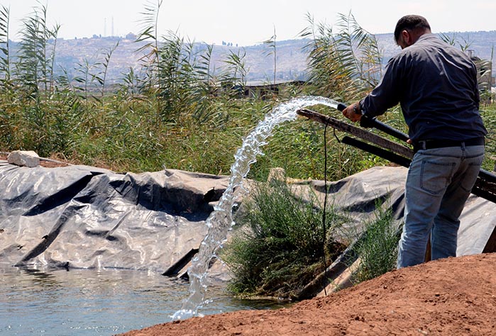 The new wastewater treatment and reuse project will help farmers to fill individual reservoirs like this one for crop irrigation.