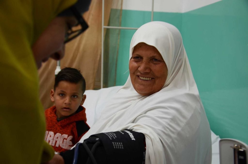 Zahiya brings her five-year-old grandson with her to the clinic in Bani Naim.
