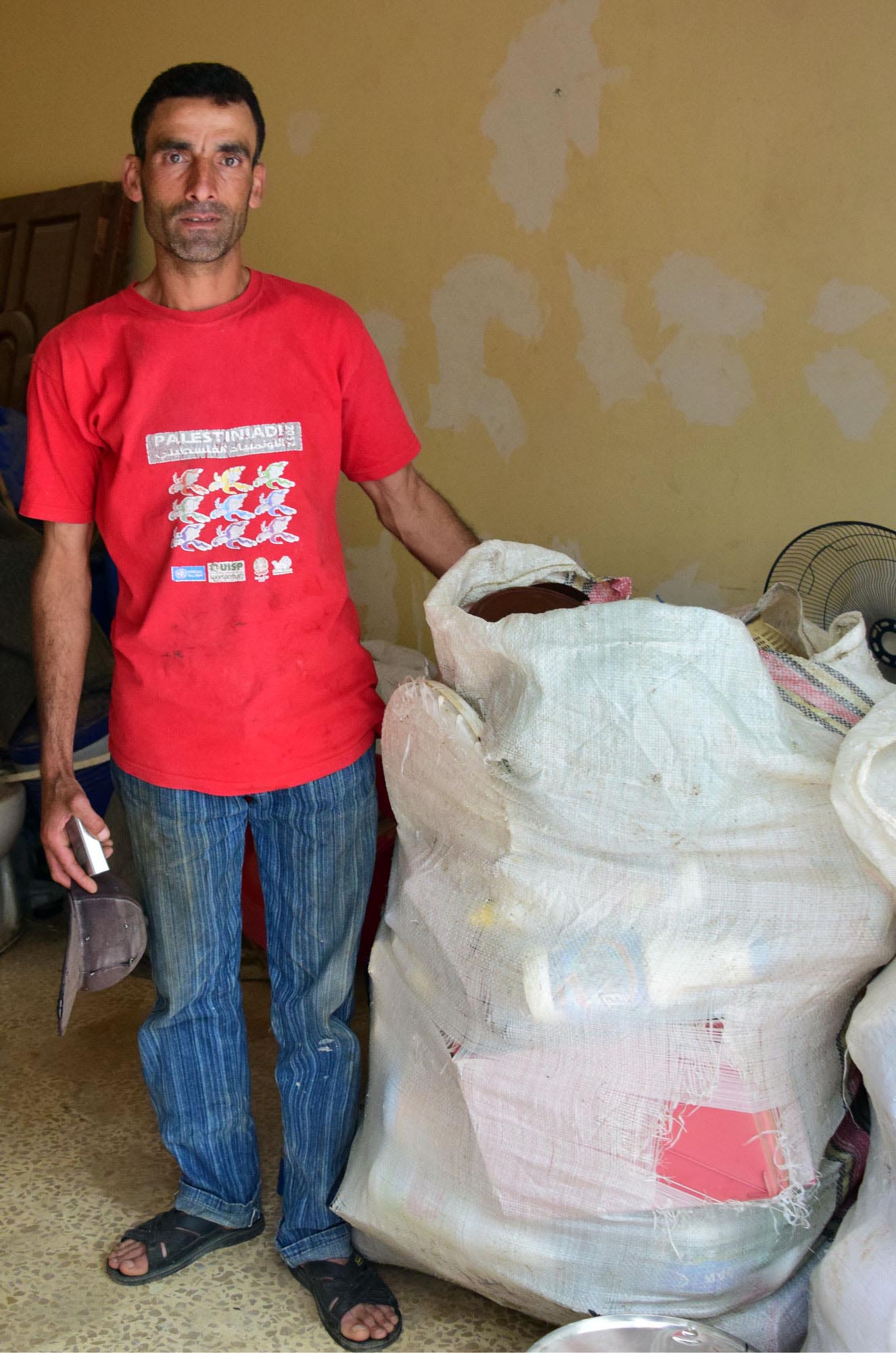 A Palestinian refugee camp recycles, making life easier for scavengers like Ayman.