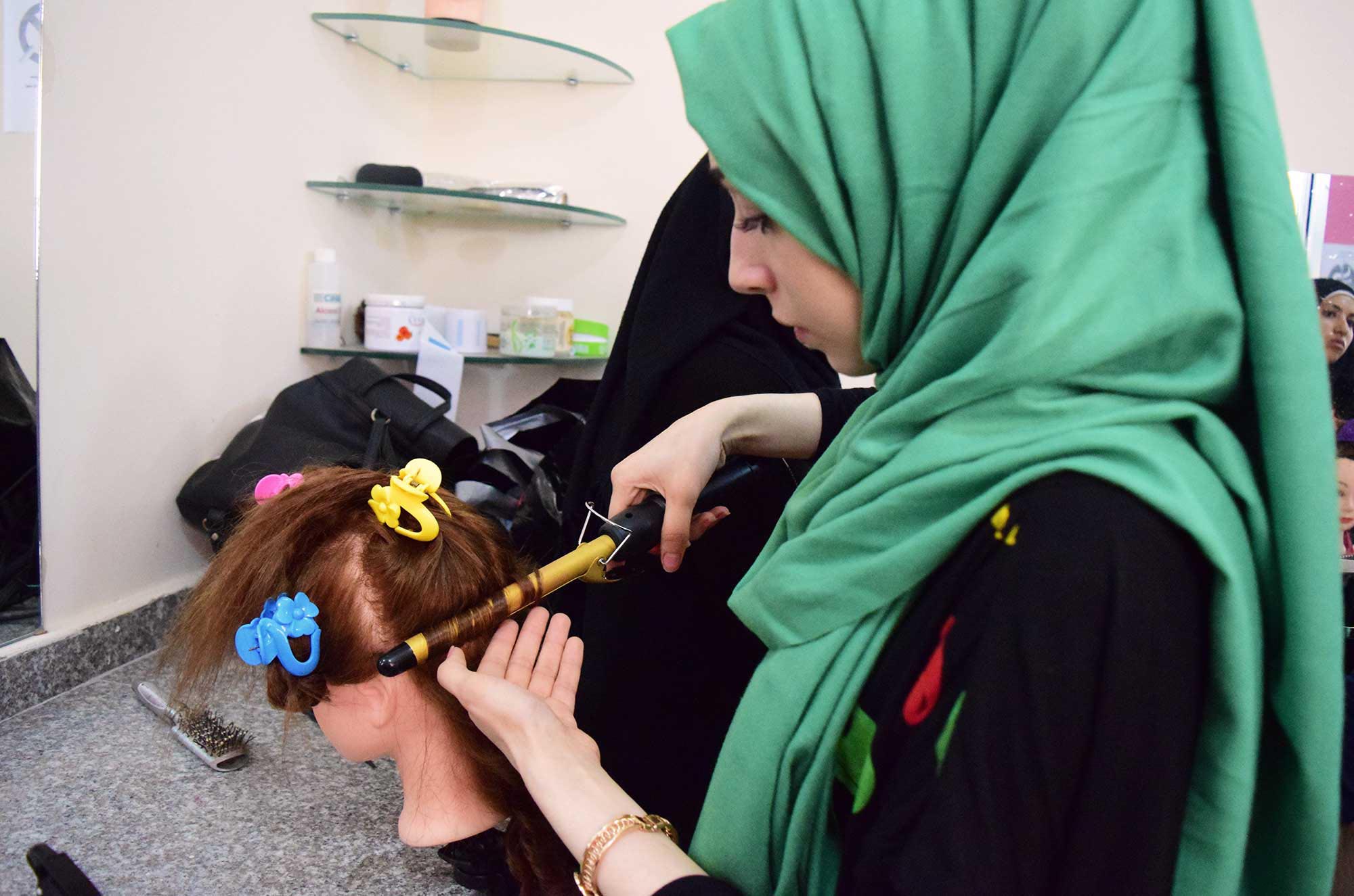 Syrian refugee students learn makeup and hairdressing in Burj El Barajneh, Lebanon.