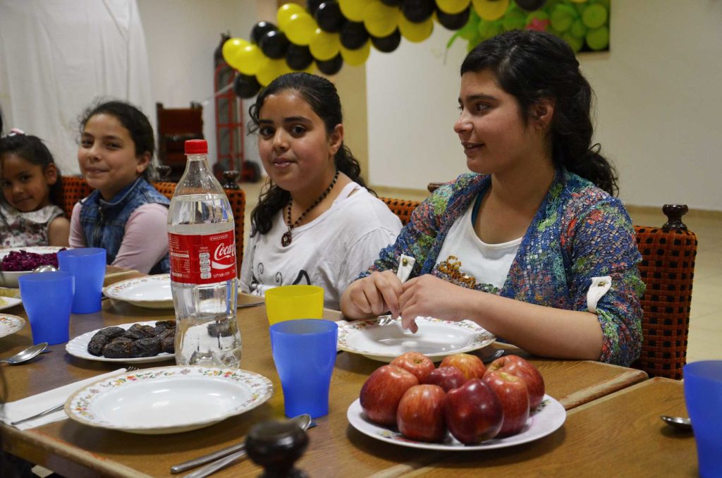 Palestinian girls have a spaghetti dinner at the Dar Al-Tifl school for orphans in East Jerusalem. 