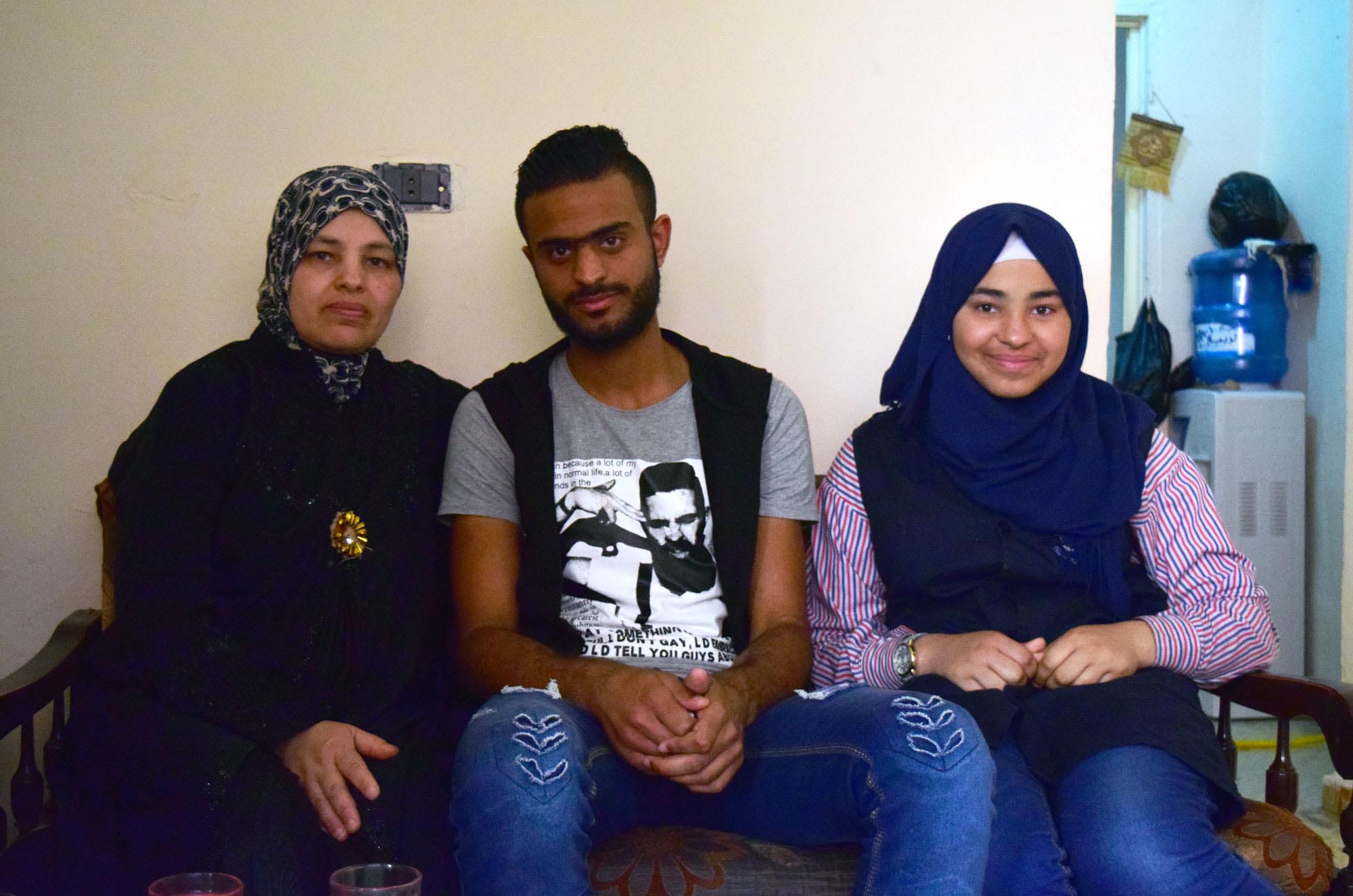 Omar, his mother and his sister inside their home in Ein El Hilweh.