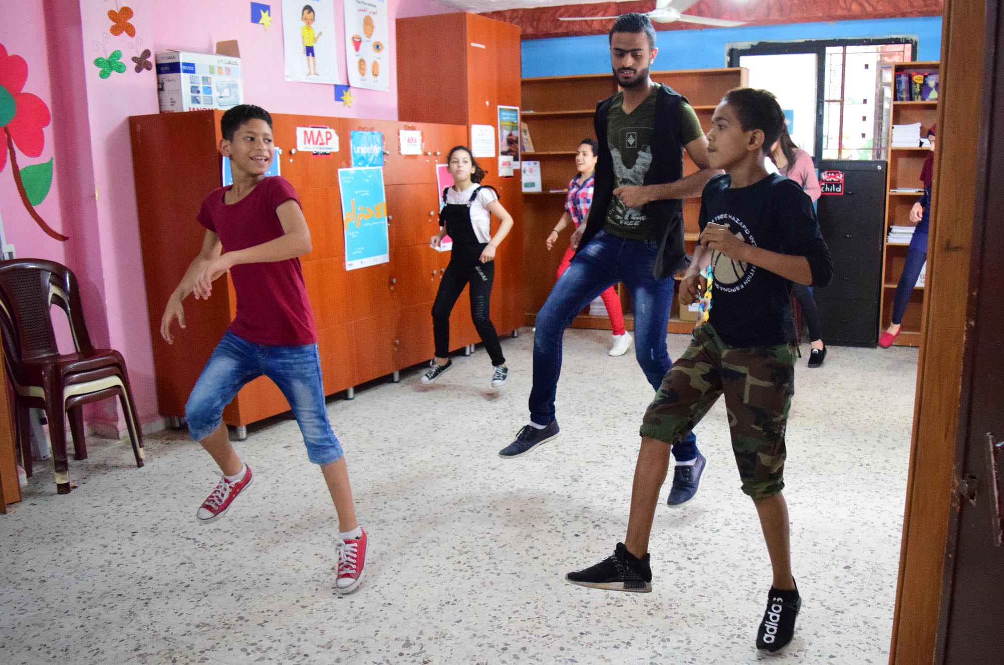 Omar teachers a youth dabke class in Ein El Hilweh camp.