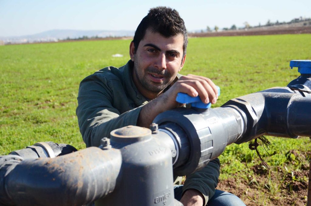 Odai grows alfalfa crops on his farm in Jenin, using recycled wastewater.