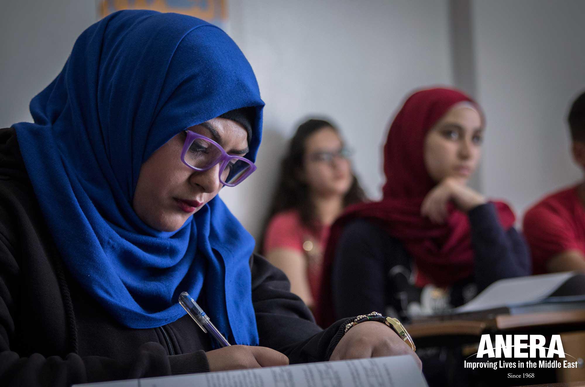 Palestinian and Syrian refugee youth attend an accounting course in Al Sharq.