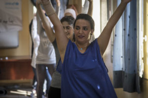 Refugee girl partakes in zumba class in Lebanon.