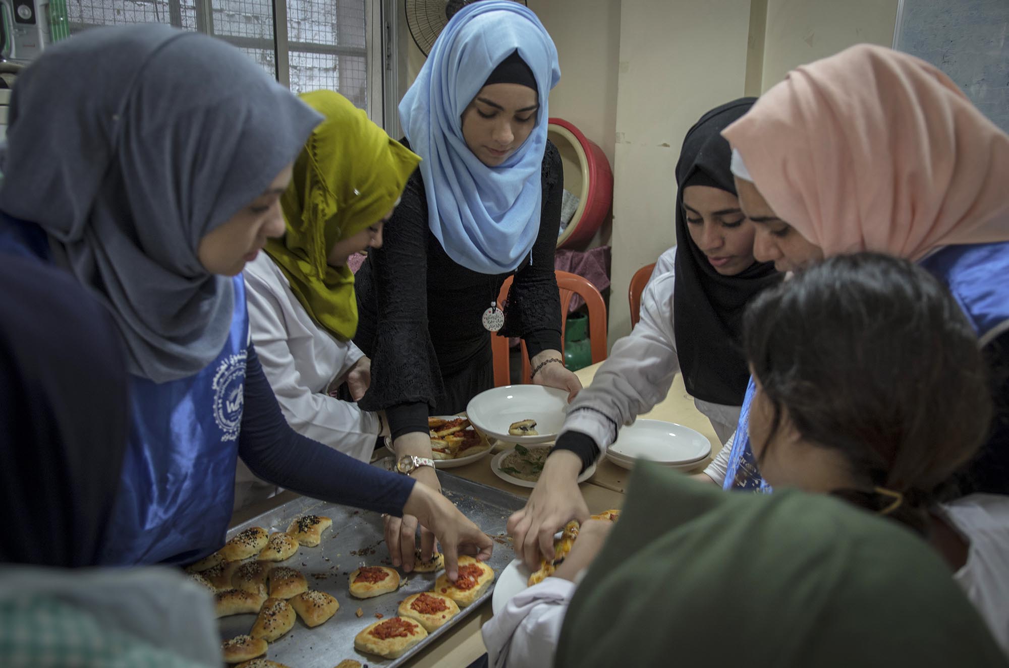 17_FoodProcessing_Etiquettes _WPA_16817-EDIT Young women learn how to cook in Anera's job skills courses.