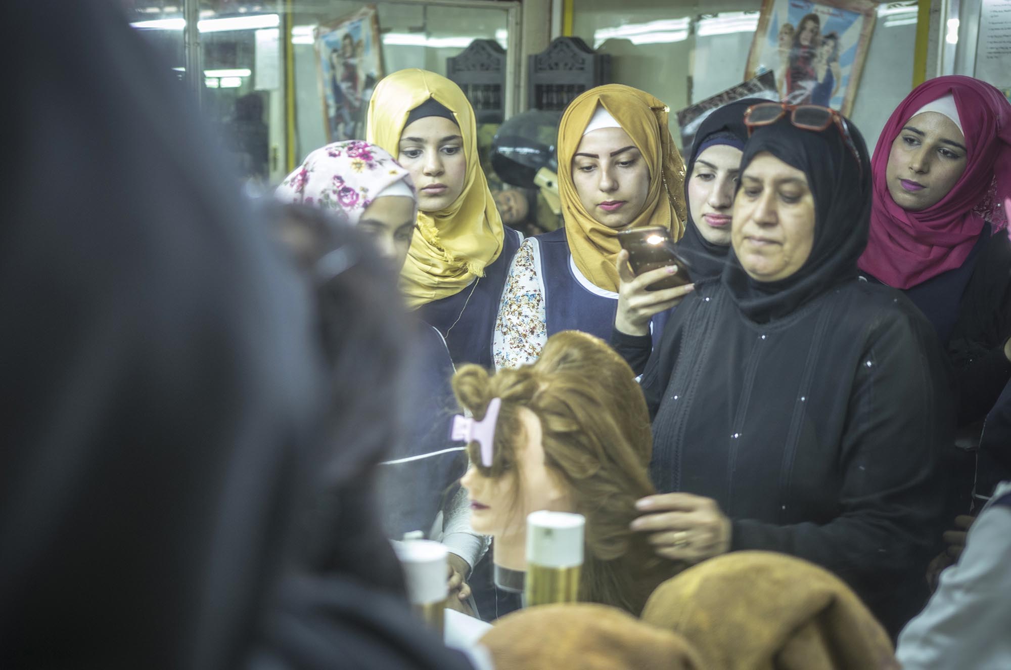 Refugee girls take a hairdressing course in Lebanon.