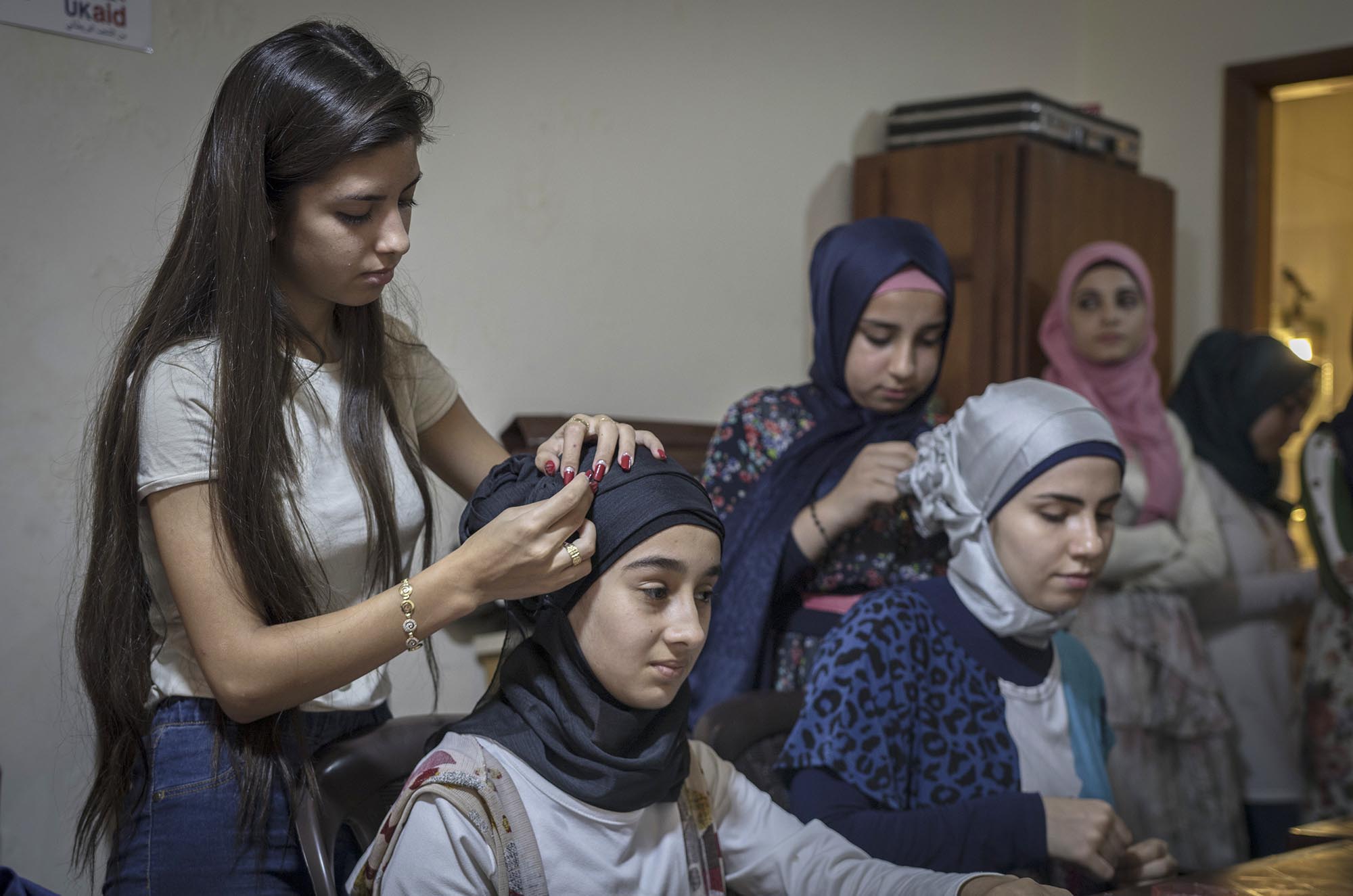 Refugee girls take a hairdressing course in Lebanon.