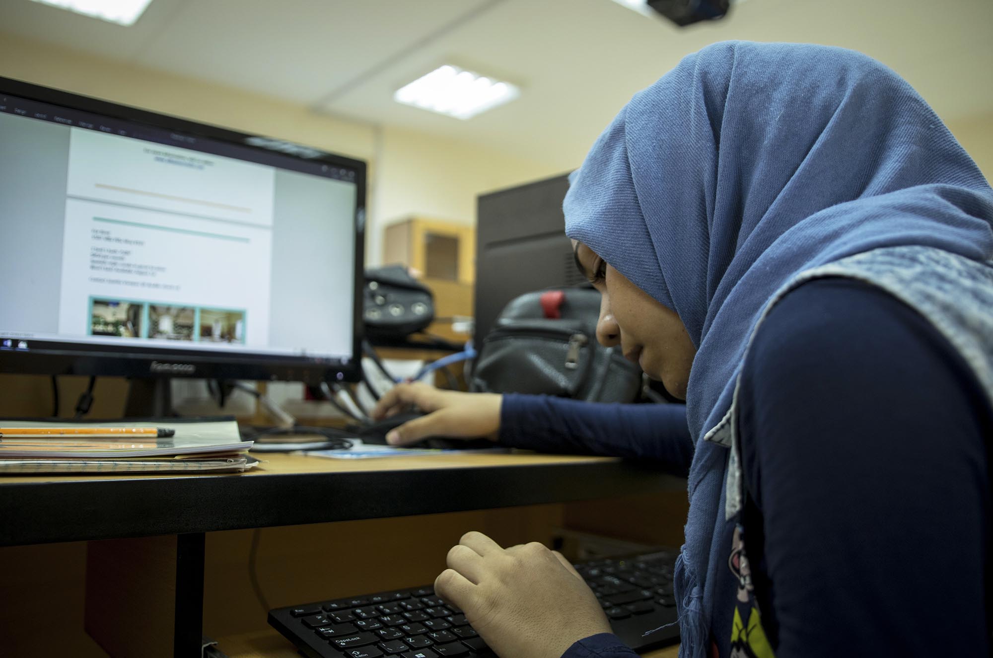 40_Computer_TamkinVocationalInstitute_16817-edit Boys and girls take computer classes in Anera's job skills courses for refugees in Lebanon.