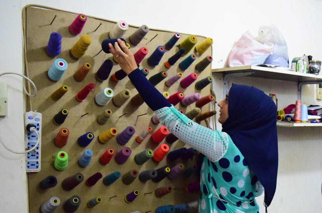 Aya, a Syrian refugee in Lebanon, attends sewing courses.
