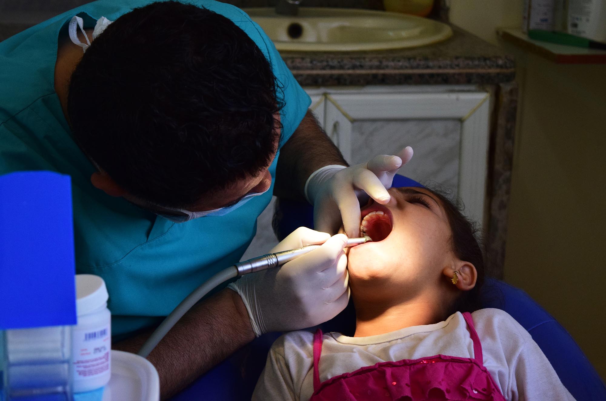 Dalaa undergoes dental treatment at a health care center in Lebanon.