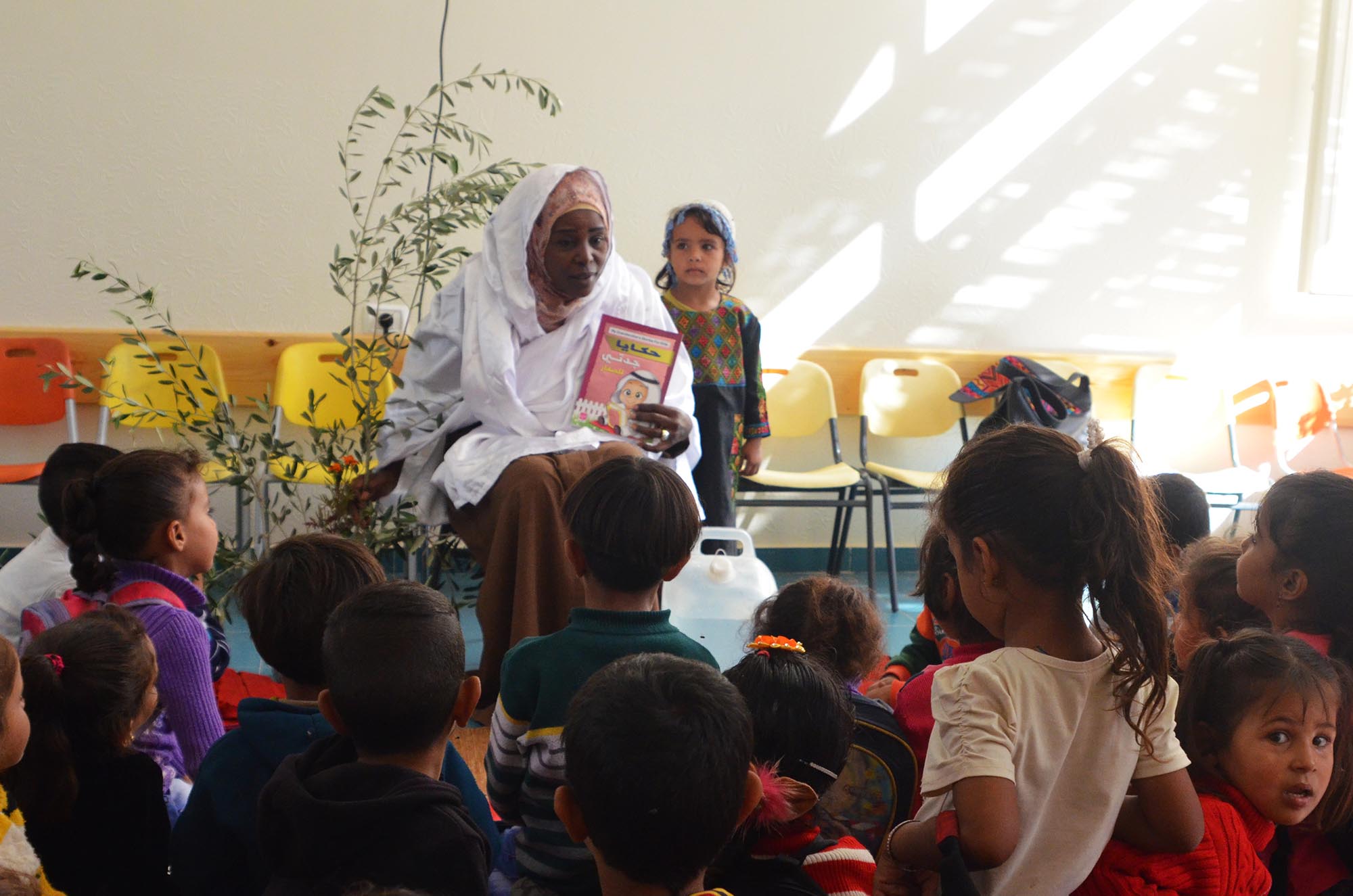 Teachers tell stories and sing songs about Gaza olive season.