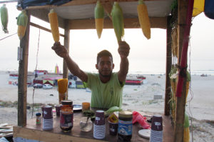A Gaza beach vendor displays corn on the cob made from a partnership with local farmers.