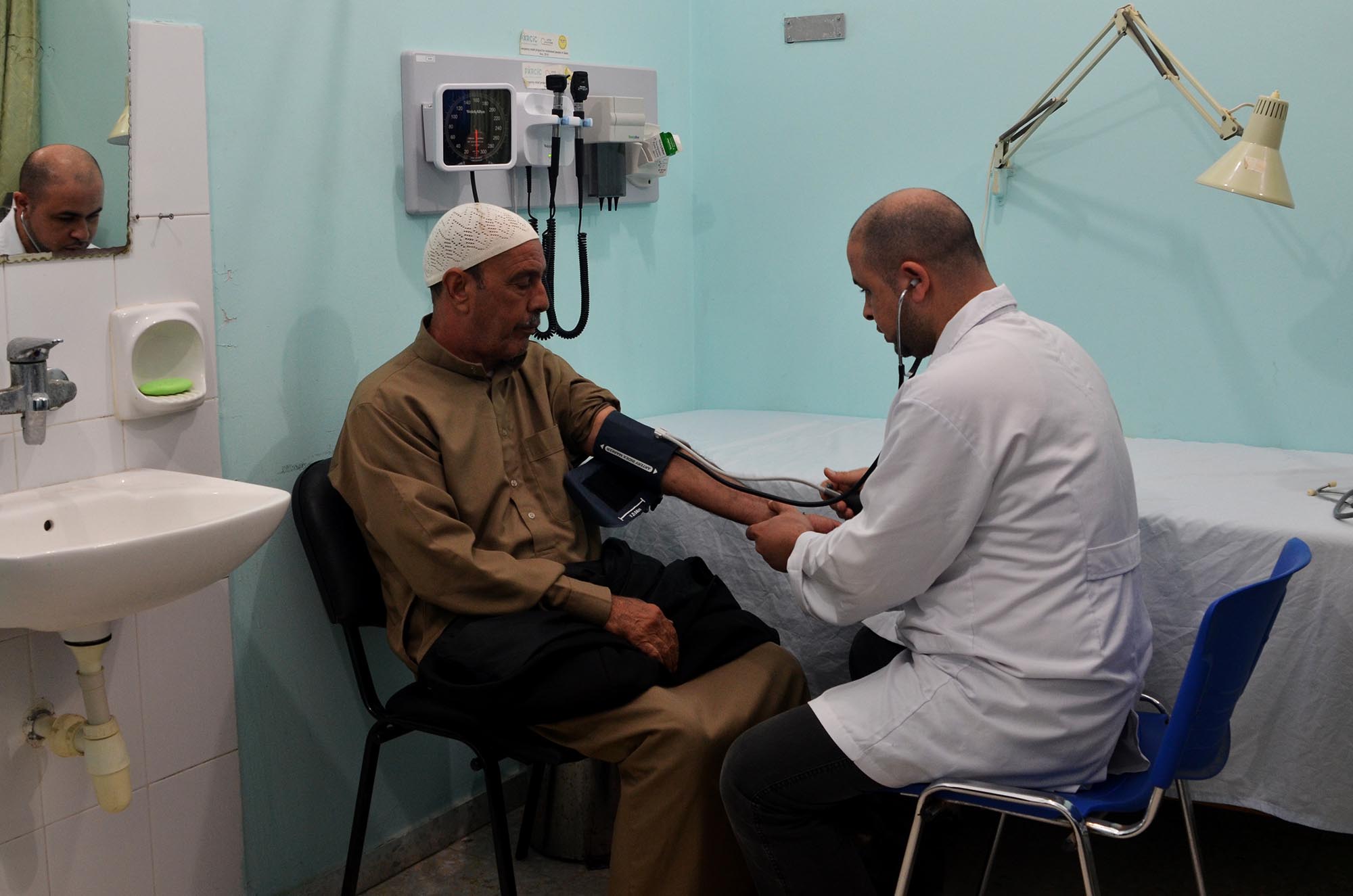 Village mediator Abu Ibrahim treats his high blood pressure at a local clinic in Gaza.