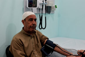 Village mediator Abu Ibrahim treats his high blood pressure at a local clinic in Gaza.