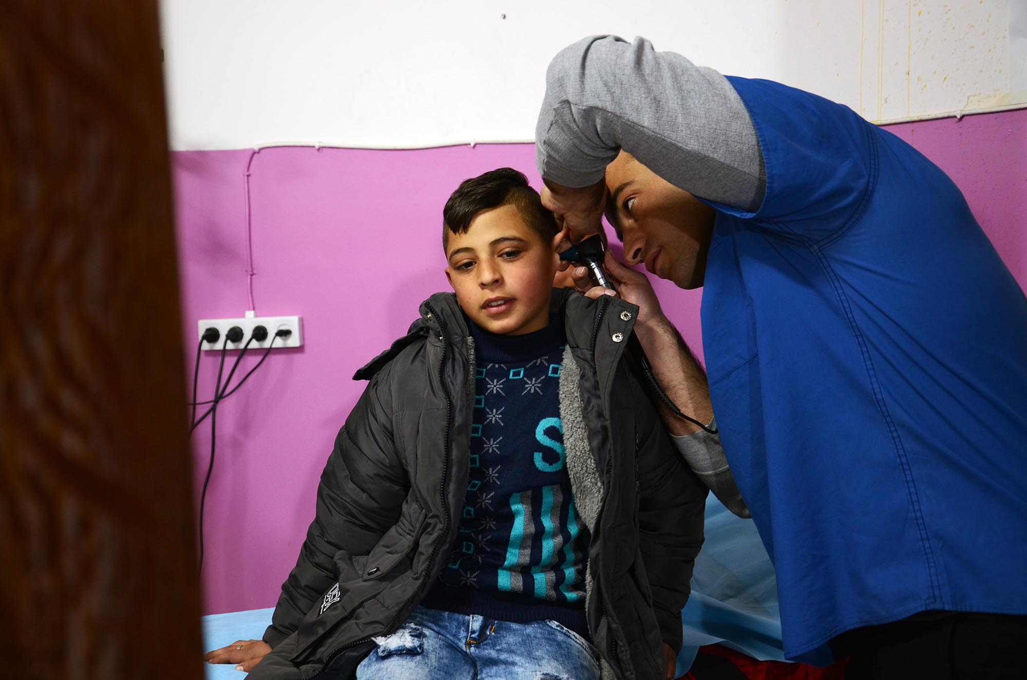 Dr. Al-Haddad examining 11-year-old Riad Al-Sharha