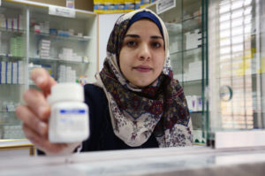 A pharmacist at Hebron's charitable medical center.