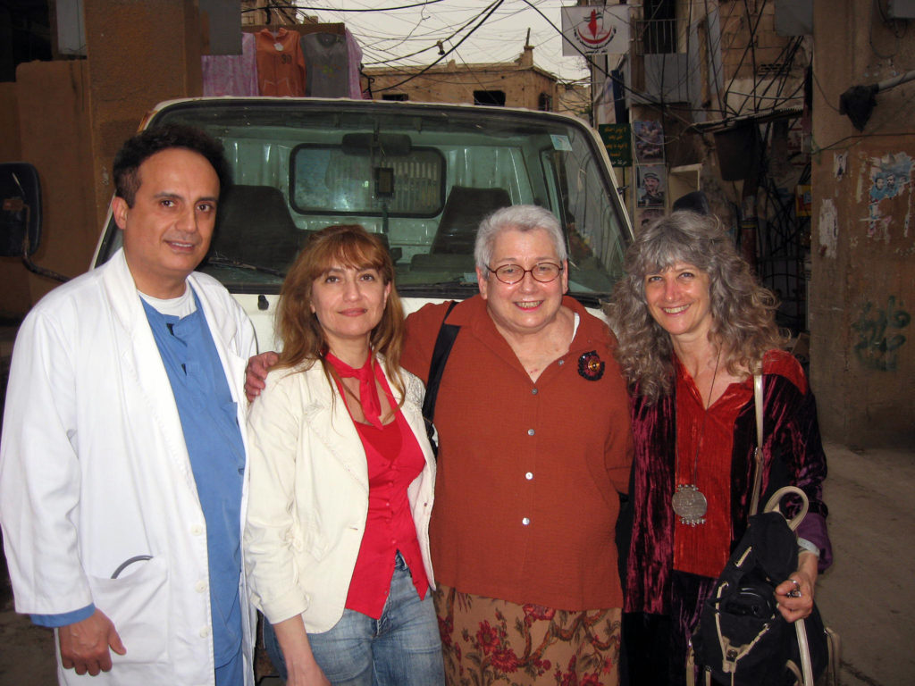 Ellen Siegel (second from right) visits with Anera staff and local partners in Shatila Palestinian refugee camp.