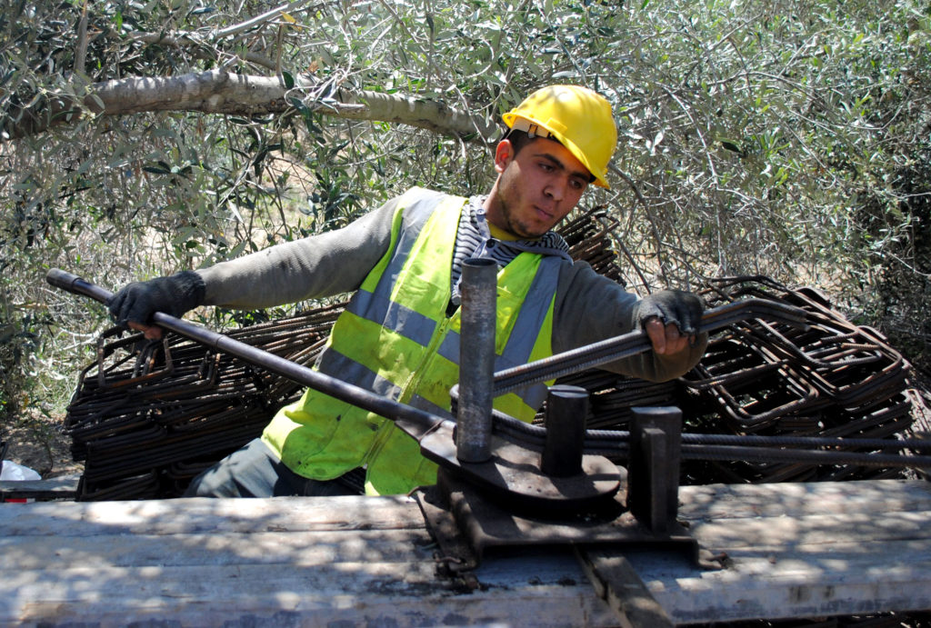 Worker at an Anera building site in Gaza.