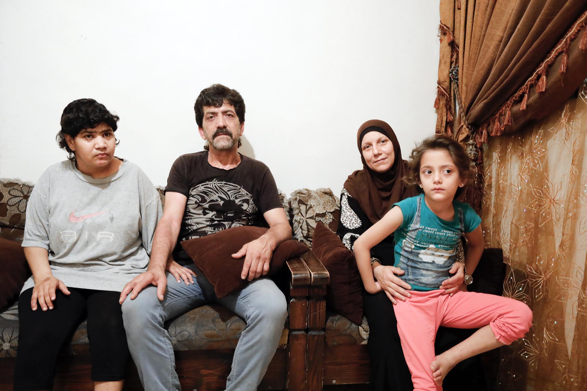 Shatila Resident Ahmad with his wife and 2 of his daughters.