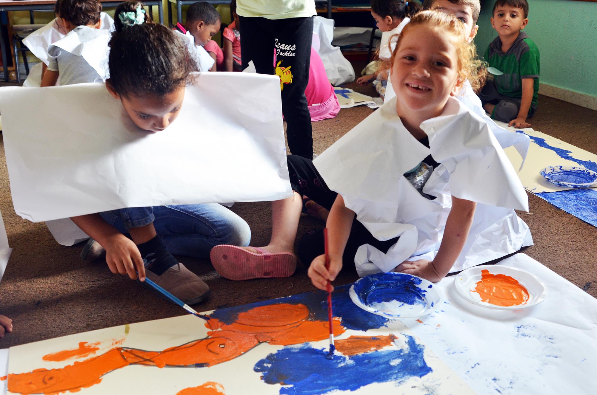 Children take part in arts and crafts activities.