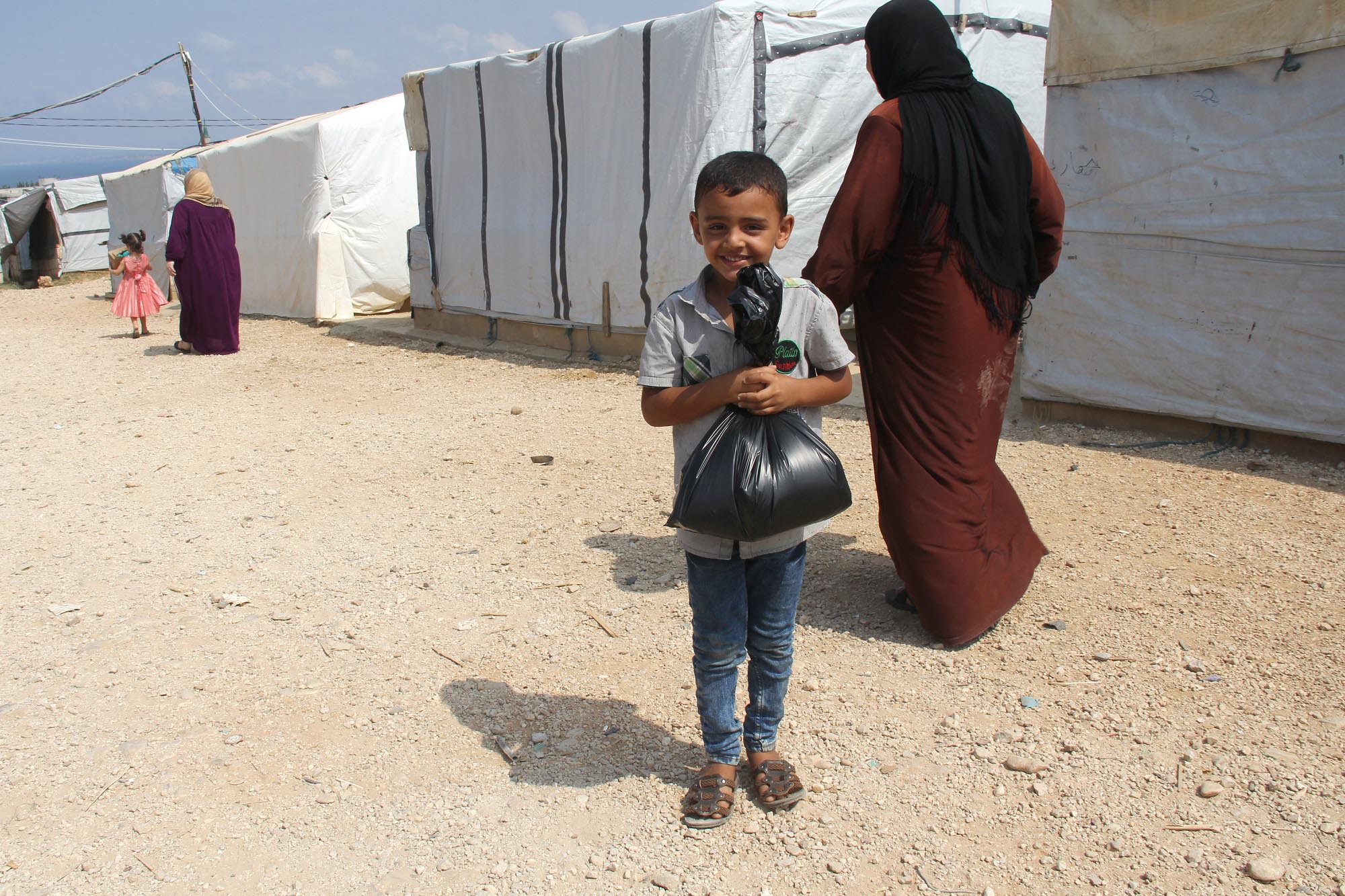 Mohammed proudly shows off his bag of products