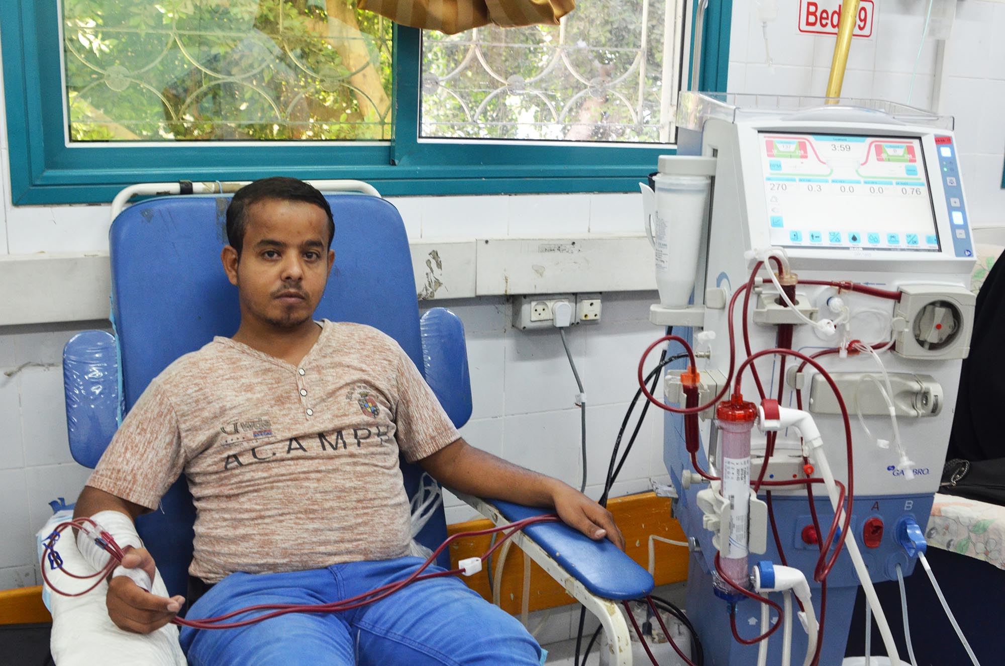 Rami, a young man who requires weekly dialysis, getting his treatment at Al-Shifa Hospital using one of the newly donated machines.