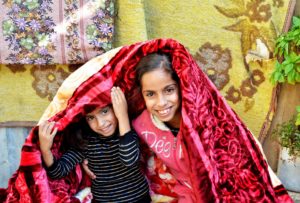 Saleh's girls with their new blanket.