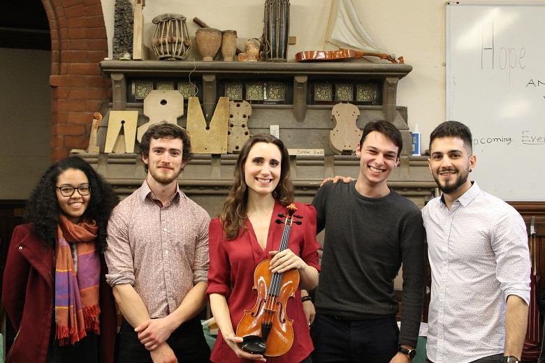 Jennifer Pike with the winning violin and team, led by Marios Pavlou (far right)