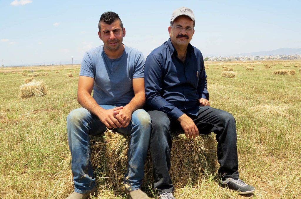 Naser (R) at the Jenin water users cooperative with a cooperative member