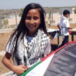 A Ni'lin schoolgirl with Palestinian flag