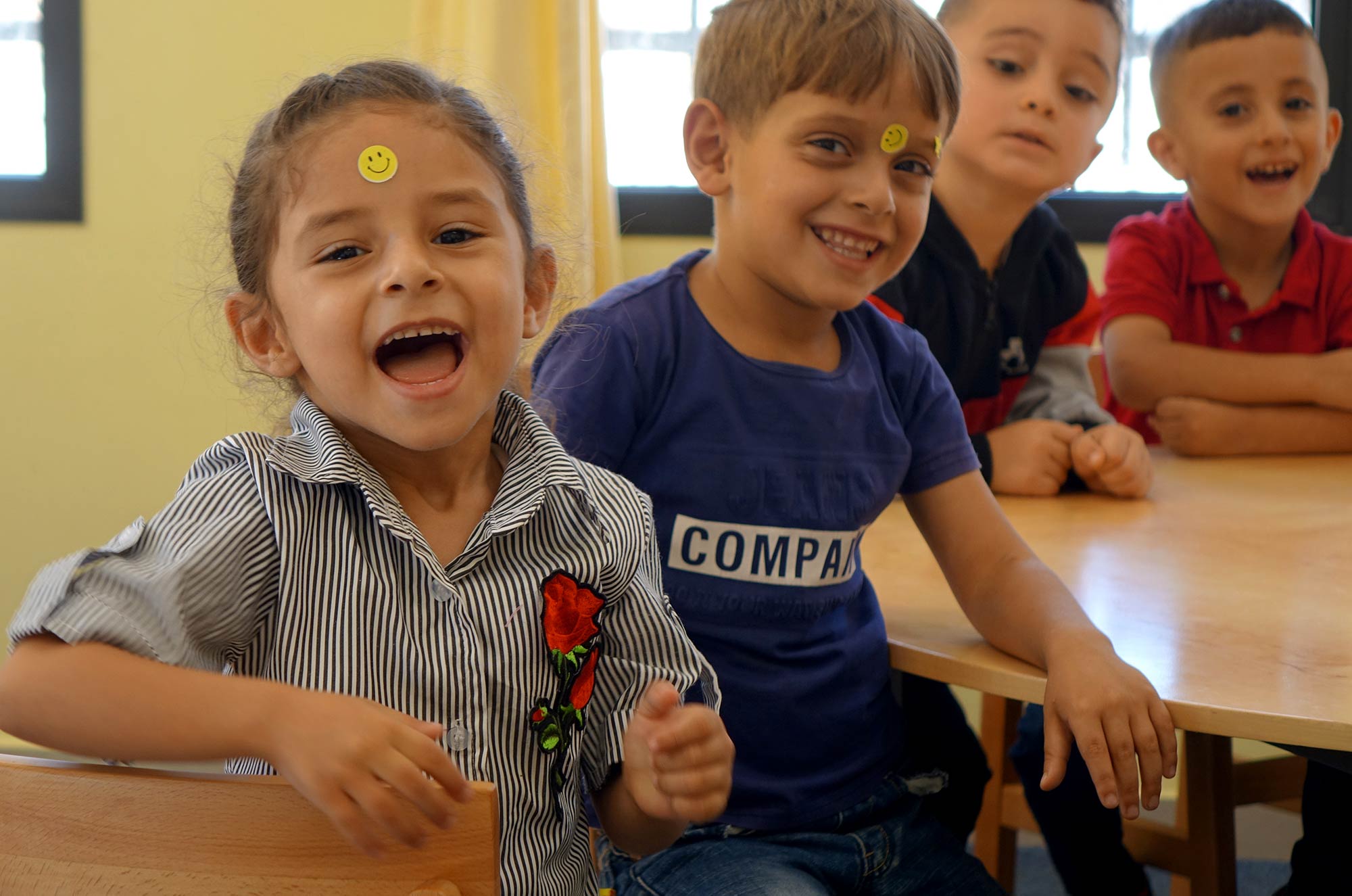 Preschoolers share a laugh in the West Bank village of Qibya, which now has a public preschool.