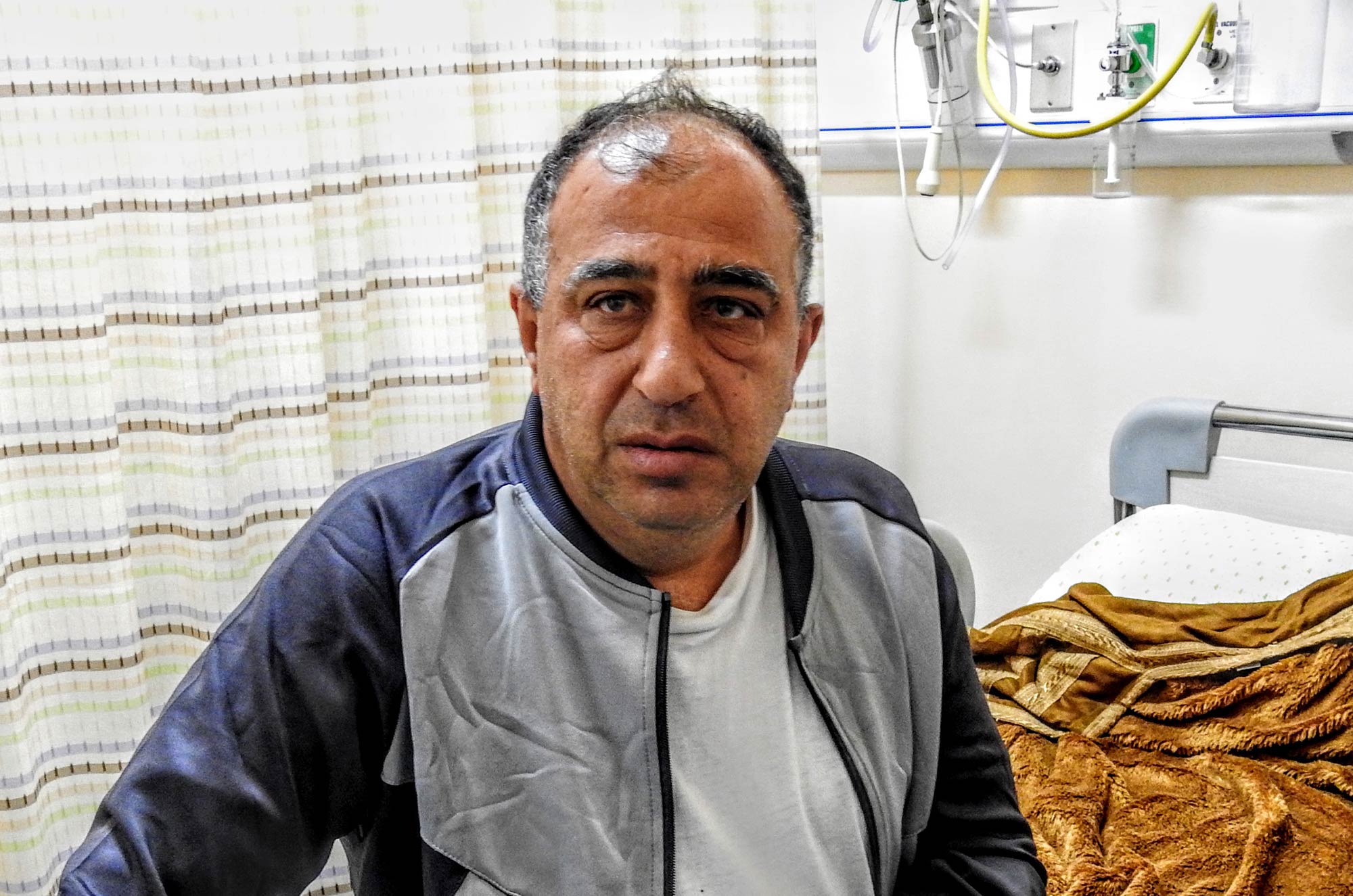medical-aid, health, Al-Ahli-Hospital, Haj Khalil Haj Khalil is treated at Al Ahli Hospital for a chest infection with donated medicine.