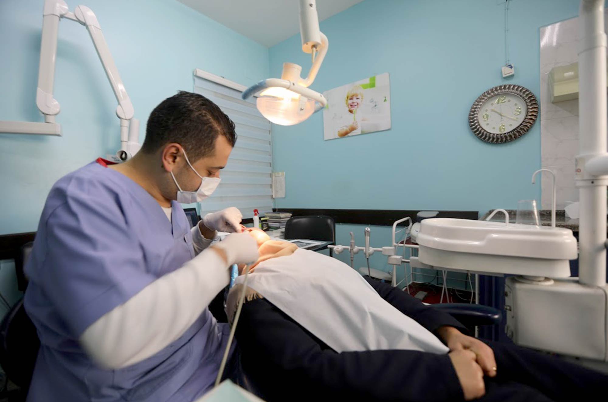 Dr. Shaban Jouda with a patient in the dentist's office