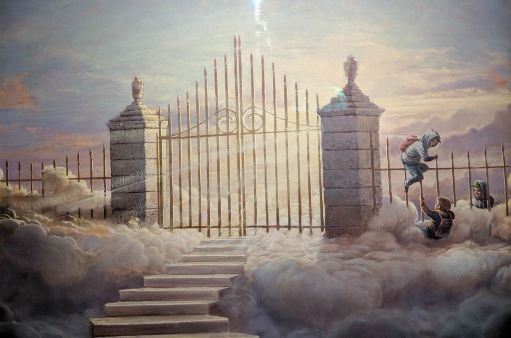 Photo by Lena of a painting at the The Walled Off Hotel of Palestinian children jumping over the gates to heaven.
