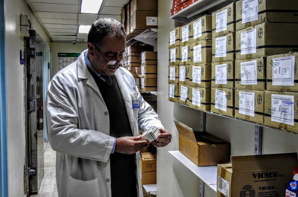 Dr. Fawaz Abu Khalaf inventories the donated medicines.