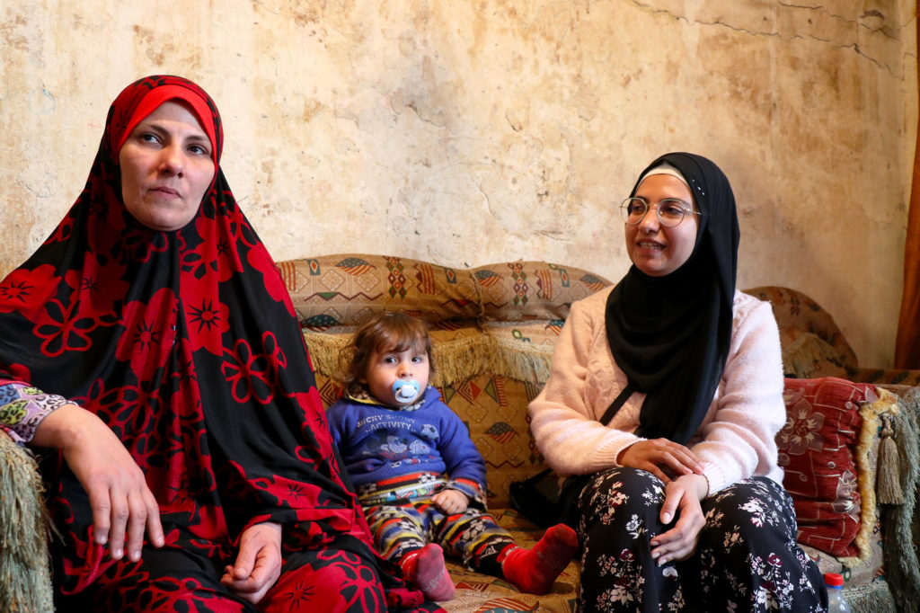 Manal (left) with two of her children in their home in Qoubbe, Lebanon